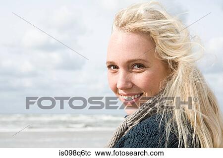 Young woman at the coast View Large Photo Image Stock Image - Young woman at the coast. Fotosearch