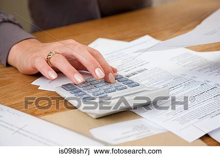 Young woman doing home finances View Large Photo Image Stock Image - Young woman doing home finances. Fotosearch