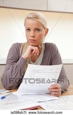 Young woman doing home finances View Large Photo Image Stock Photograph - Young woman doing home finances. Fotosearch