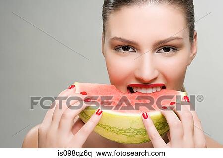 Young woman eating watermelon View Large Photo Image Stock Photography - Young woman eating watermelon. Fotosearch