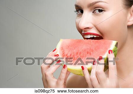 Young woman eating watermelon View Large Photo Image Stock Photography - Young woman eating watermelon. Fotosearch