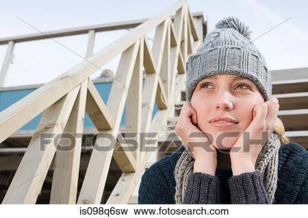 Stock Photo - Young woman in a knit hat. Fotosearch