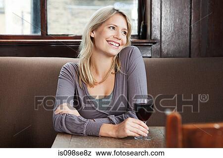 Young woman in bar View Large Photo Image Stock Photo - Young woman in bar. Fotosearch