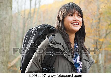 Stock Photo - Young woman in forest. Fotosearch