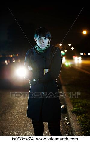 Young woman on road at night View Large Photo Image Picture - Young woman on road at night. Fotosearch
