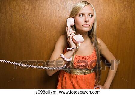 Picture - Young woman on telephone. Fotosearch