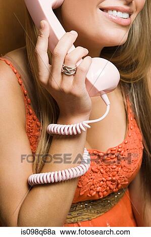Stock Image - Young woman on telephone. Fotosearch