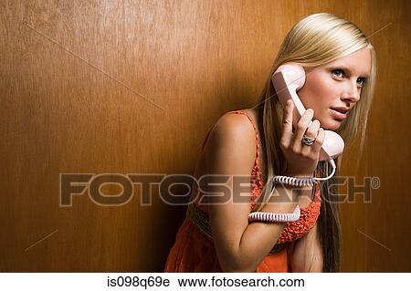 Stock Image - Young woman on telephone. Fotosearch