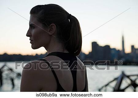 Young woman outdoors View Large Photo Image Stock Image - Young woman outdoors. Fotosearch