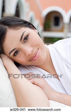 Stock Image - Young woman relaxing. Fotosearch