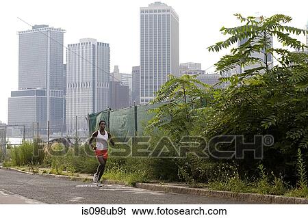 Stock Photograph - Young woman running in brooklyn. Fotosearch