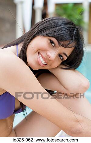 Stock Image - Young woman smiling. Fotosearch