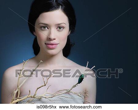 Stock Photo - Young woman with a branch. Fotosearch