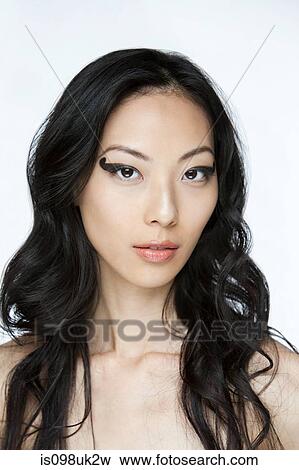 Young woman with black eye makeup View Large Photo Image Stock Photo - Young woman with black eye makeup. Fotosearch