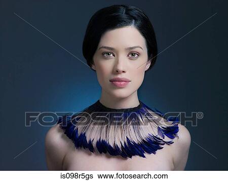 Young woman with feather necklace View Large Photo Image Stock Photograph - Young woman with feather necklace. Fotosearch