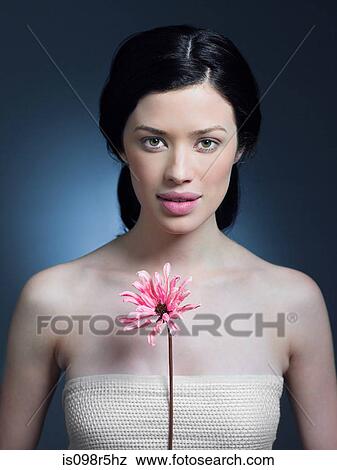 Stock Photo - Young woman with flower. Fotosearch
