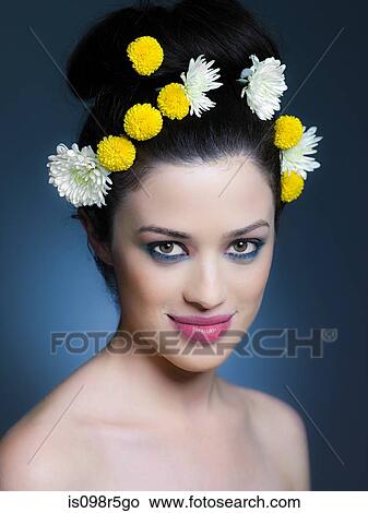 Picture - Young woman with flowers in hair. Fotosearch