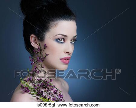 Young woman with flowers View Large Photo Image Stock Image - Young woman with flowers. Fotosearch