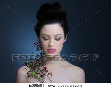 Young woman with flowers View Large Photo Image Stock Image - Young woman with flowers. Fotosearch