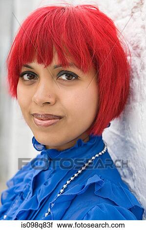 Stock Image - Young woman with red hair. Fotosearch