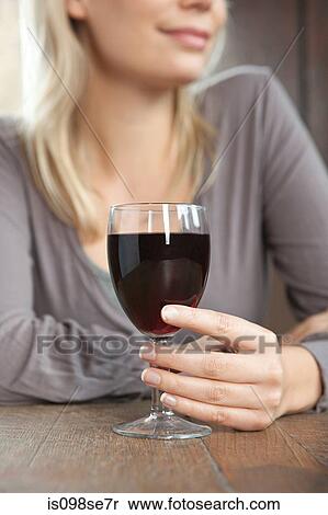 Young woman with red wine in bar View Large Photo Image Stock Photography - Young woman with red wine in bar. Fotosearch