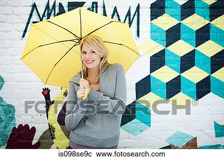 Young woman with umbrella View Large Photo Image Stock Image - Young woman with umbrella. Fotosearch