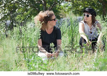 Young women hanging out View Large Photo Image Stock Photo - Young women hanging out. Fotosearch