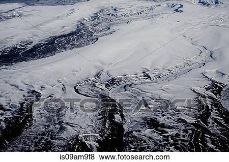 Stock Photo - "Aerial view of snow covered landscape, Ushuaia, Tierra del Fuego, Argentina". Fotosearch