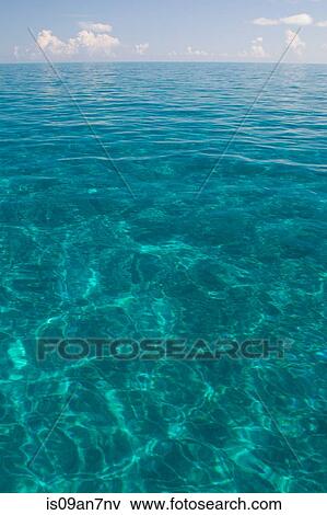 Stock Photo - Calm water on a Summer's day.. Fotosearch