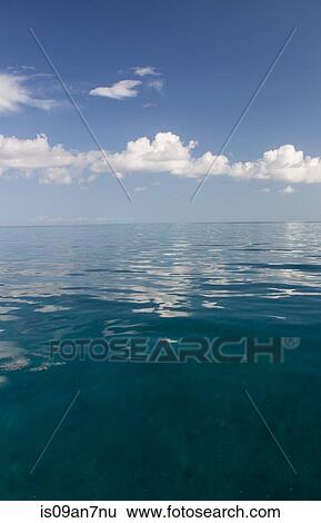 Calm water on a Summer's day. View Large Photo Image Stock Photograph - Calm water on a Summer's day.. Fotosearch