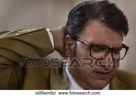 Close up of mature businessman with eyes closed and hand on head View Large Photo Image Stock Image - Close up of mature businessman with eyes closed and hand on head. Fotosearch