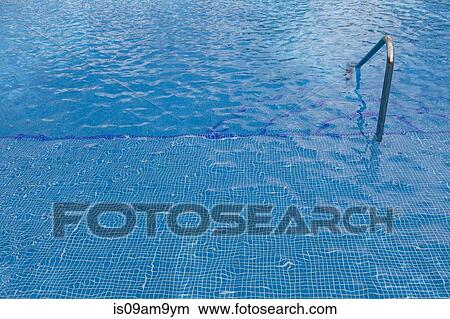 Detail of turquoise swimming pool and railing View Large Photo Image Picture - Detail of turquoise swimming pool and railing. Fotosearch