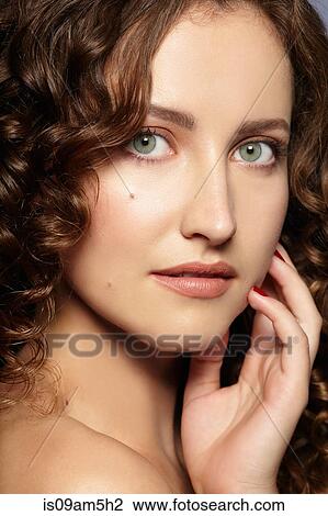 Stock Image - Female model looking at camera. Fotosearch