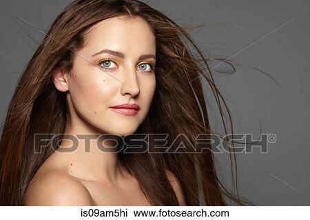 Stock Image - Female model looking at camera. Fotosearch