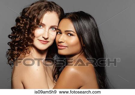 Female models hugging View Large Photo Image Stock Photo - Female models hugging. Fotosearch
