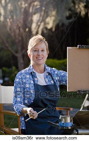 Stock Photography - "Female plein-air painter in Albin Polasek Museum and Sculpture Garden, Winter Park, Florida, USA". Fotosearch