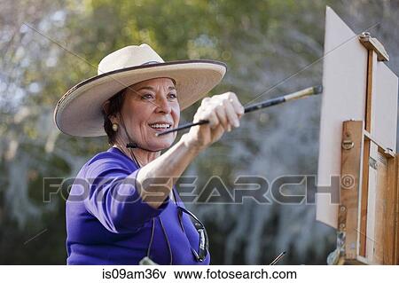 "Female plein-air painter painting in Albin Polasek Museum and Sculpture Garden, Winter Park, Florida, USA" View Large Photo Image Stock Photo - "Female plein-air painter painting in Albin Polasek Museum and Sculpture Garden, Winter Park, Florida, USA". Fotosearch