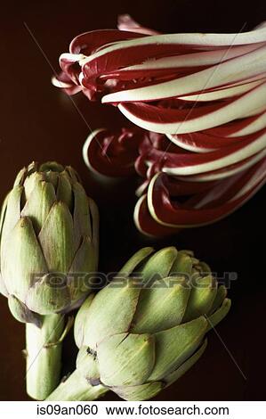 Stock Image - Globe artichokes and cabbage. Fotosearch
