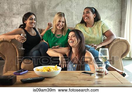 Group of female friends having girls night in View Large Photo Image Picture - Group of female friends having girls night in. Fotosearch