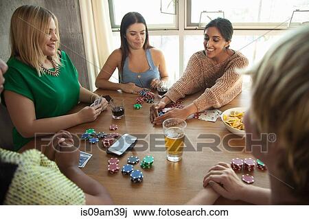 Group of friends playing cards around table View Large Photo Image Stock Image - Group of friends playing cards around table. Fotosearch