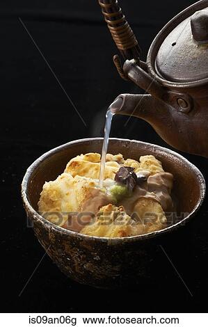 Hot water from kettle pouring over bowl of food View Large Photo Image Stock Image - Hot water from kettle pouring over bowl of food. Fotosearch