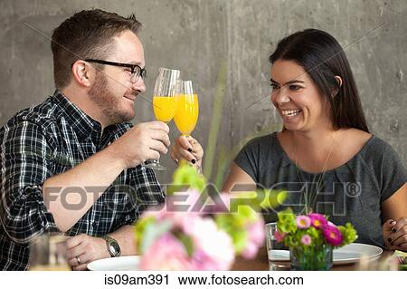 Man and woman clinking glasses View Large Photo Image Stock Image - Man and woman clinking glasses. Fotosearch