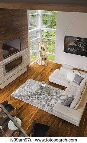 Stock Photograph - Modern interior design luxury living room with beige leather sofa and fireplace. Fotosearch