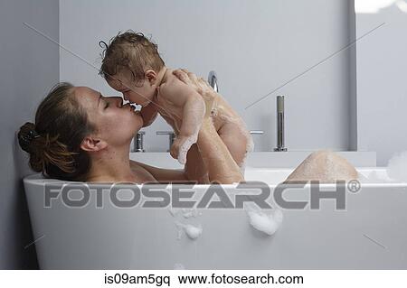 Mother and baby girl in bathtub View Large Photo Image Stock Photography - Mother and baby girl in bathtub. Fotosearch