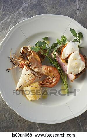 "Plate with seafood, herb garnish and lemon slice" View Large Photo Image Stock Photo - "Plate with seafood, herb garnish and lemon slice". Fotosearch