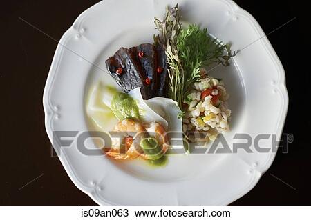Plate with seafood variety and barley with sliced vegetable and herbs View Large Photo Image Stock Image - Plate with seafood variety and barley with sliced vegetable and herbs. Fotosearch