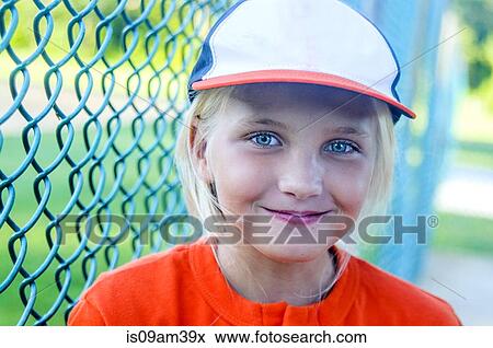Portrait of young girl wearing baseball kit View Large Photo Image Stock Photo - Portrait of young girl wearing baseball kit. Fotosearch