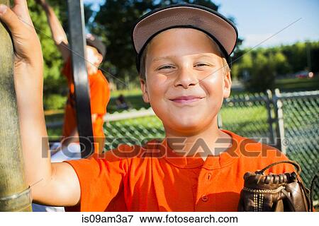 Stock Photo - Portrait of young male baseball player. Fotosearch