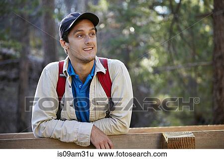 Stock Photograph - "Portrait of young male hiker in forest, Los Angeles, California, USA". Fotosearch