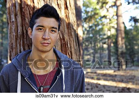 "Portrait of young man in forest, Los Angeles, California, USA" View Large Photo Image Stock Photo - "Portrait of young man in forest, Los Angeles, California, USA". Fotosearch